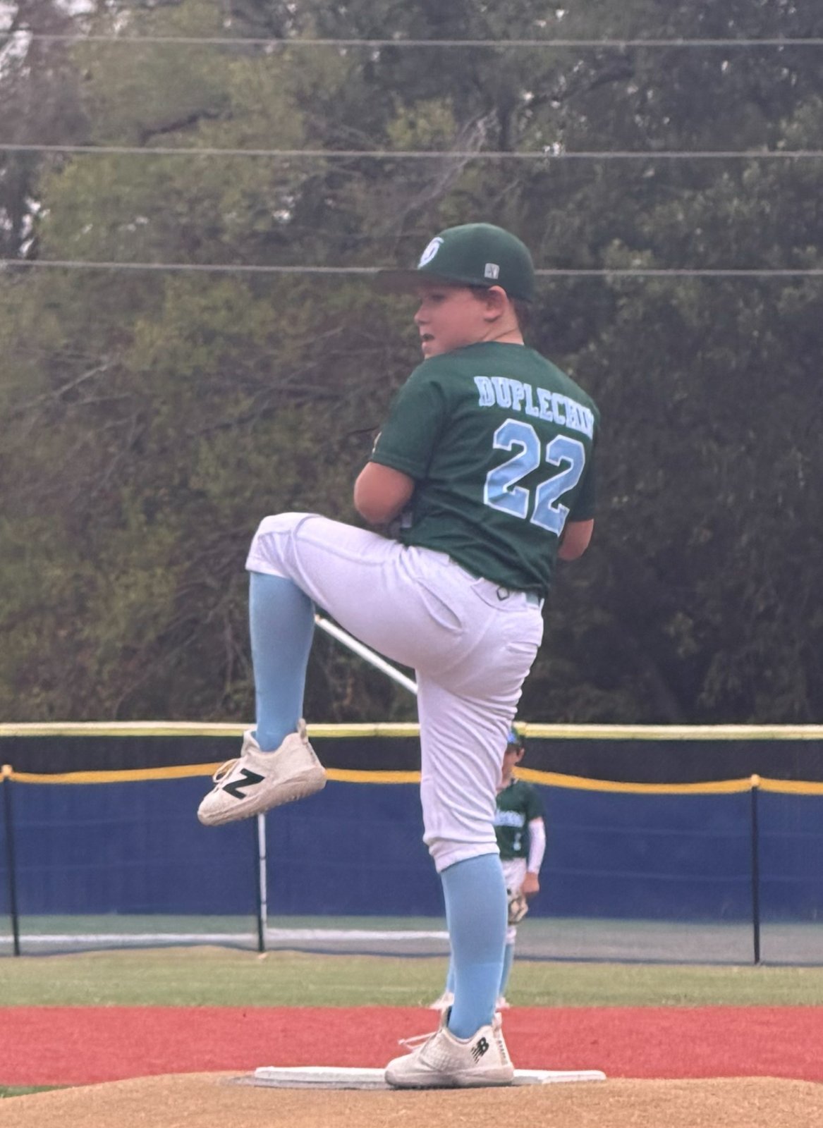 Bennett, number 22, in his leg kick on the mound