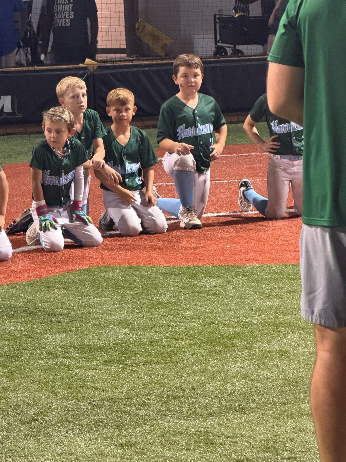 Players kneeling together on the field